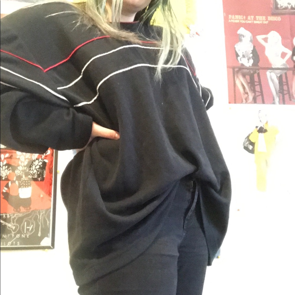 Black sweater with white and red stripes